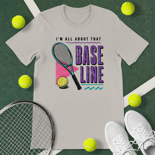 Light grey t-shirt with the text 'I'M ALL ABOUT THAT BASELINE' and a graphic of a tennis racket and tennis ball.