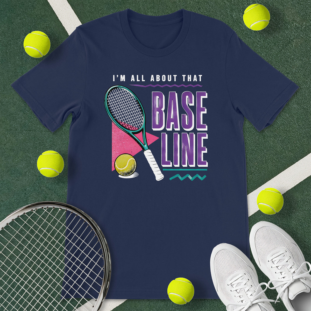 Navy blue t-shirt with the text 'I'M ALL ABOUT THAT BASELINE' and a graphic of a tennis racket and tennis ball.