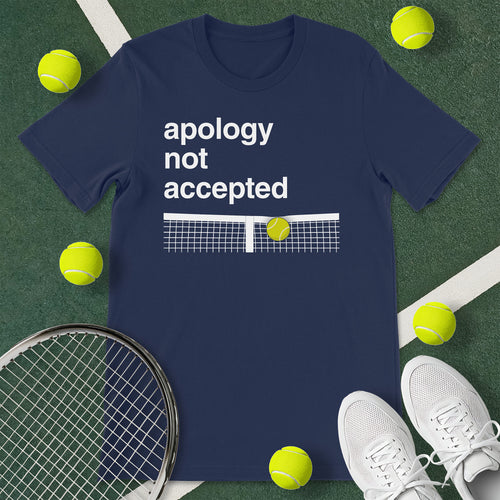 Navy blue t-shirt with the text 'apology not accepted' and a graphic of a tennis ball going over a net.