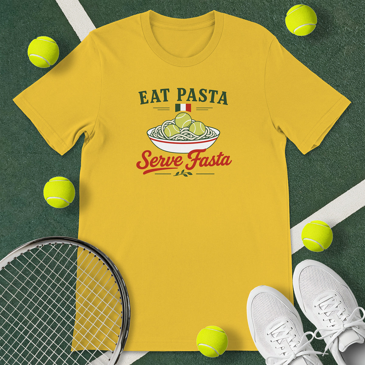 Yellow t-shirt with the text 'EAT PASTA Serve Fasta' and a graphic of a bowl of spaghetti with tennis balls instead of meatballs.