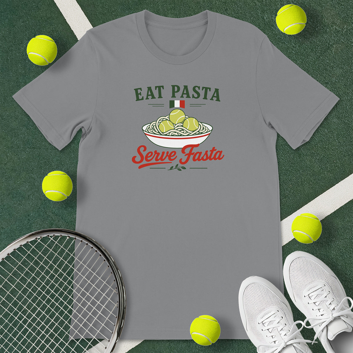 Grey t-shirt with the text 'EAT PASTA Serve Fasta' and a graphic of a bowl of spaghetti with tennis balls instead of meatballs.