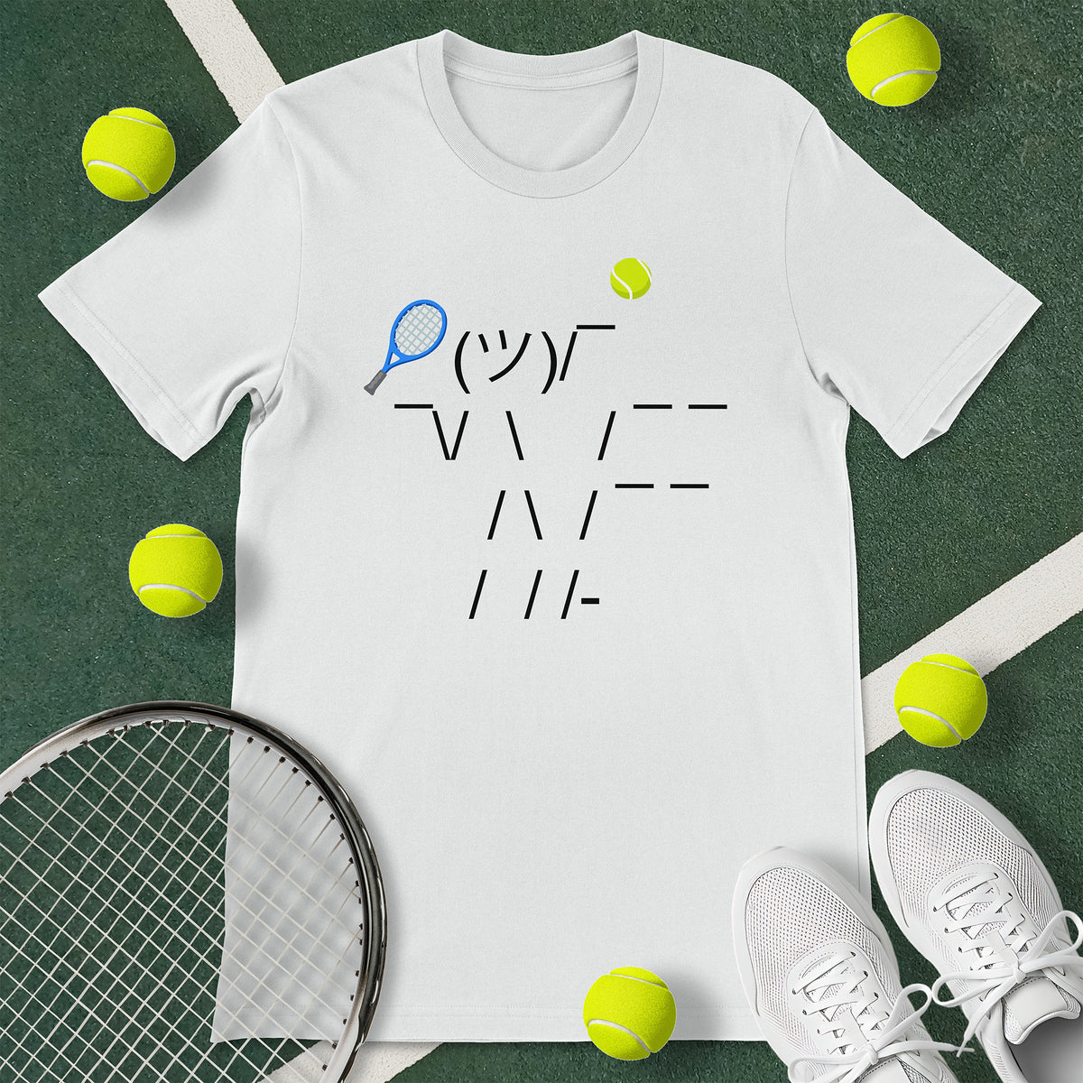 White t-shirt with a graphic of an emoticon. The emoticon is of a person serving a tennis ball. 