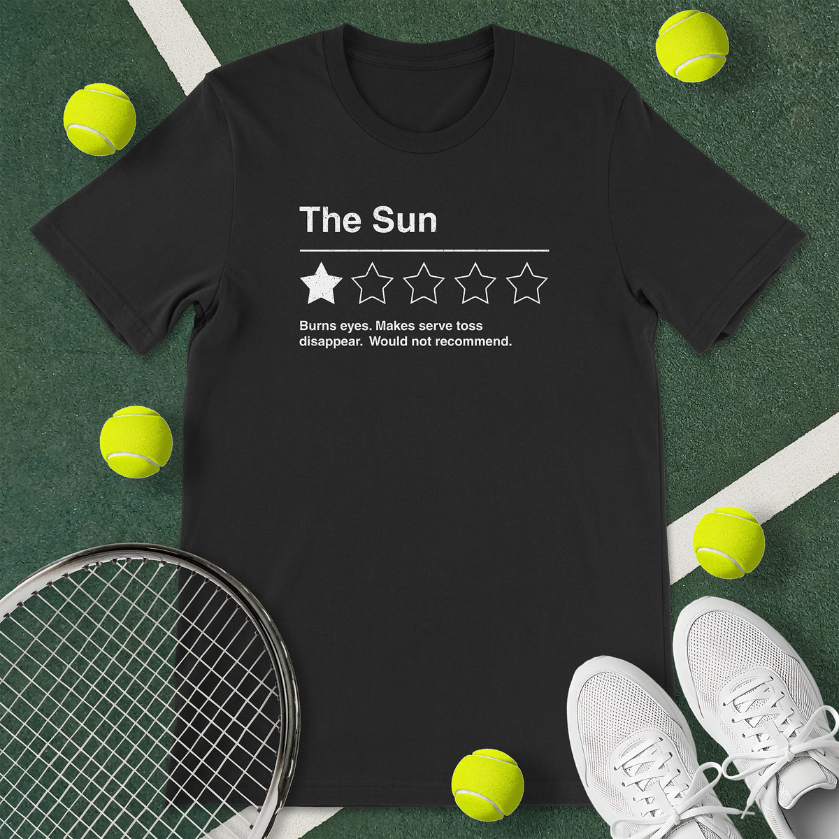 Black t-shirt with the text 'The Sun - Burns eyes. Makes serve toss disappear. Would not recommend.' and a graphic of 1 star.