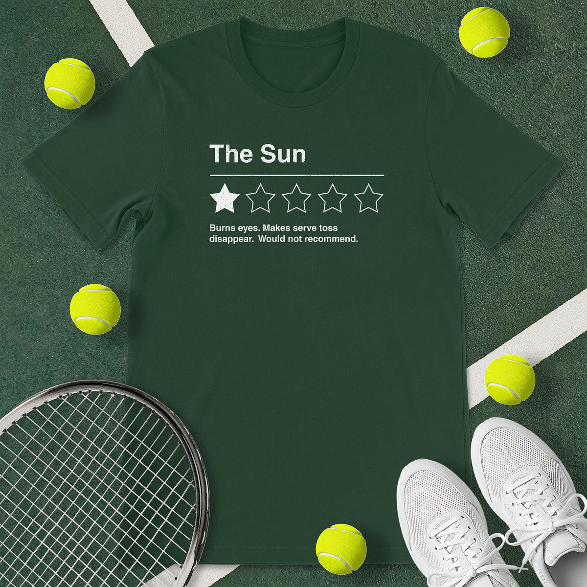 Forest green t-shirt with the text 'The Sun - Burns eyes. Makes serve toss disappear. Would not recommend.' and a graphic of 1 star.