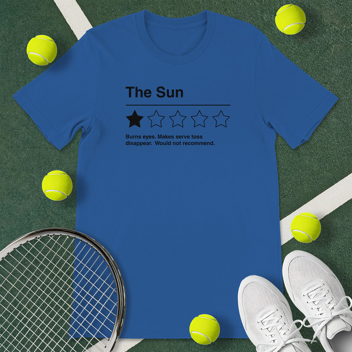 Royal blue t-shirt with the text 'The Sun - Burns eyes. Makes serve toss disappear. Would not recommend.' and a graphic of 1 star.